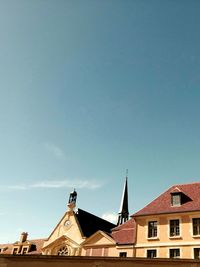 Low angle view of building against blue sky