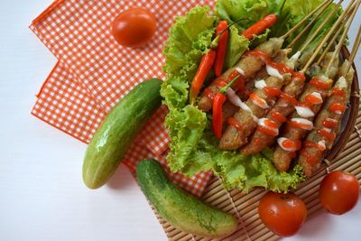 High angle view of tomatoes in plate on table