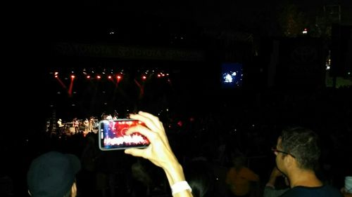 People enjoying at concert