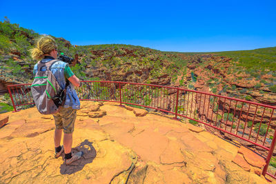 Rear view full length of man photographing at kalbarri national park