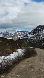 Scenic view of snowcapped mountains against sky