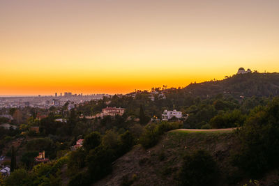 Panoramic view of townscape against sky during sunset