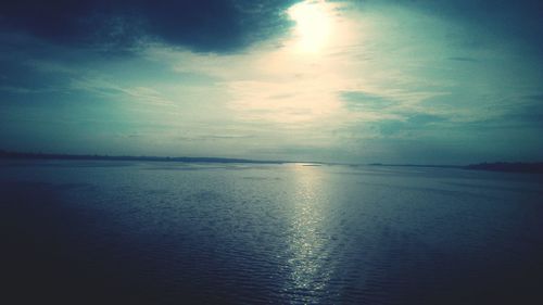 Scenic view of sea against sky at sunset