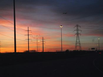 Scenic view of landscape against sky at sunset