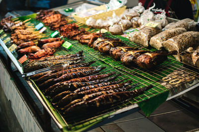 High angle view of meat on barbecue grill