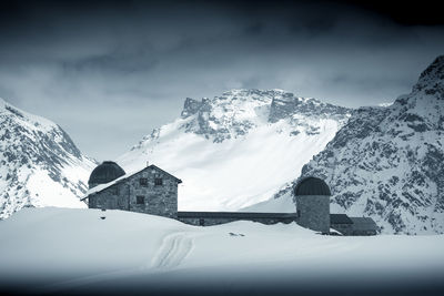 Snow covered mountains against sky