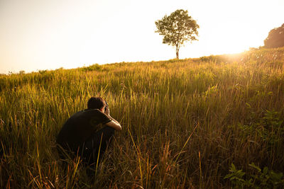 Scenic view of grassy field against clear sky