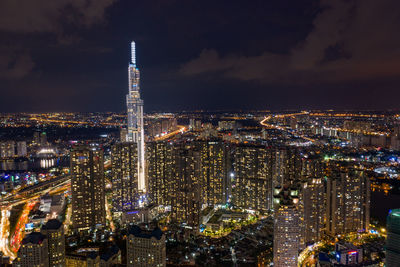 High angle view of city lit up at night