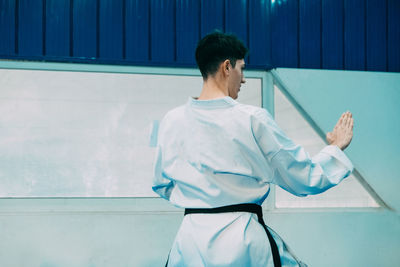 Rear view of man playing karate