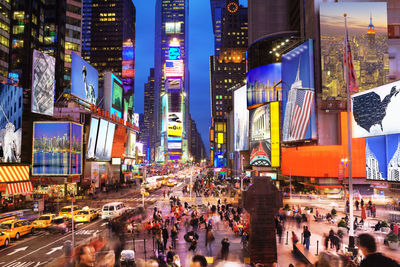 People on city street at night