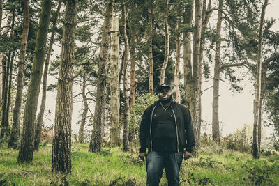 People standing in forest