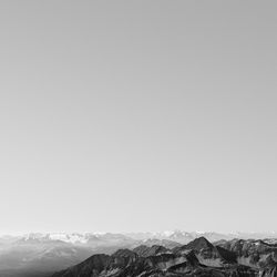 Scenic view of snowcapped mountains against clear sky