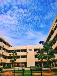 Low angle view of buildings against blue sky