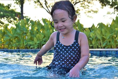 Cute girl in swimming pool