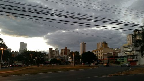 City street against cloudy sky