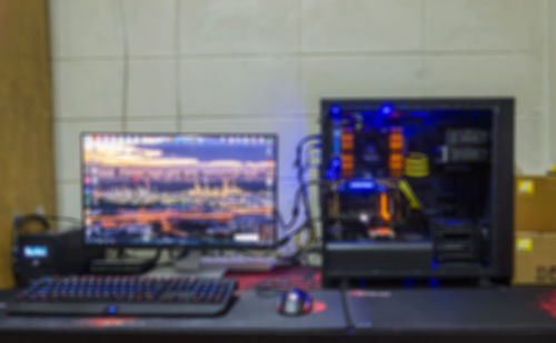 Close-up of illuminated laptop on table