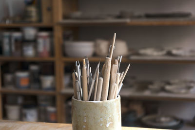 Ceramic working tools. art craft sculpting tools brush in a pottery workshop.