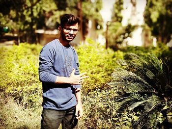 Portrait of young man standing outdoors