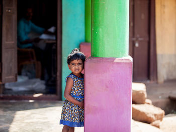 Cute girl holding pink hair