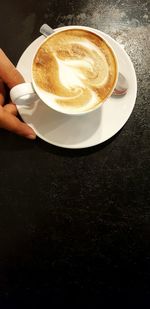 Close-up of coffee cup on table