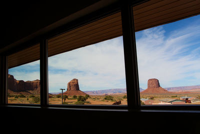 Scenic view of landscape seen through window