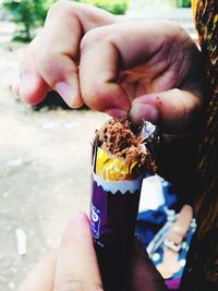 Midsection of person holding ice cream