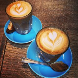 High angle view of cappuccino on table.