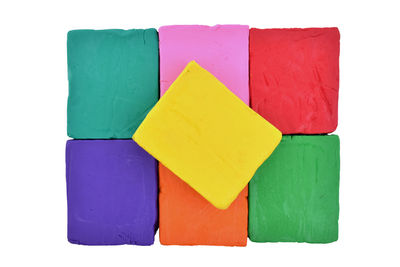 Close-up of multi colored pencils against white background