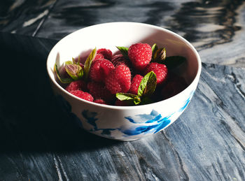 High angle view of strawberries in bowl on table