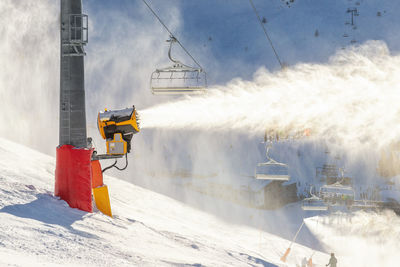 Panoramic view of cars on snow