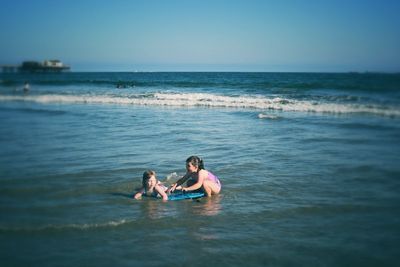 People relaxing in sea