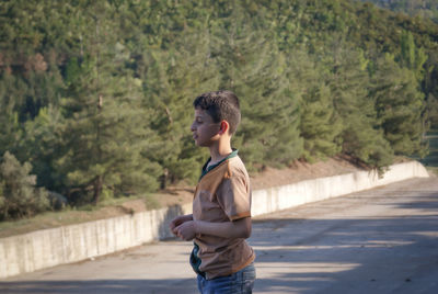 Boy standing on road