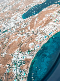 Aerial view of landscape seen through airplane window