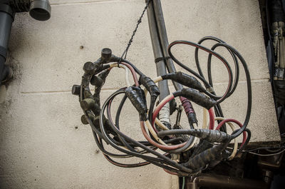 High angle view of bicycle parked against wall