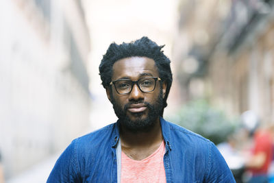 Portrait of young man standing outdoors