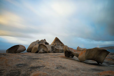 Rocks on shore against sky