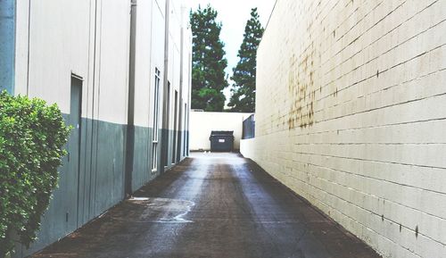 Surface level of empty road along buildings