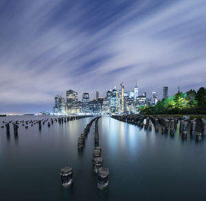 Manhattan glows across east river nyc