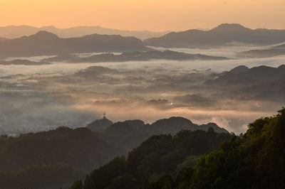 Scenic view of mountains against sky during sunset