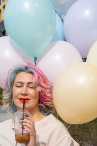 Young woman with balloons