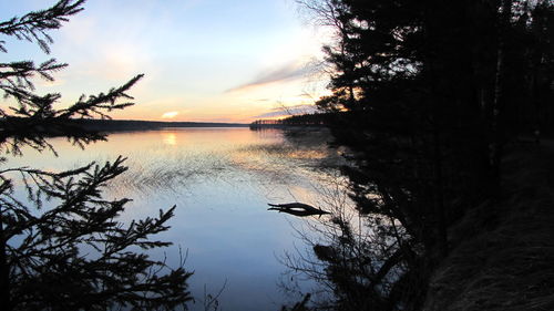 Scenic view of lake at sunset