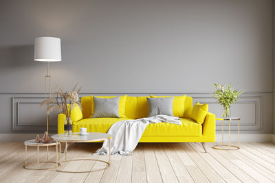 Table and yellow chair on bed at home