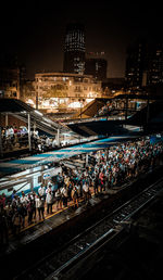 High angle view of illuminated railroad tracks at night