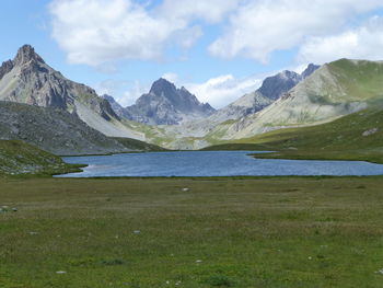 Scenic view of lake and mountains against sky