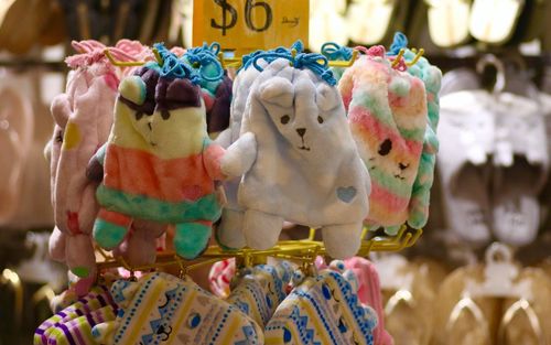 Close-up of multi colored stuffed toys for sale in market