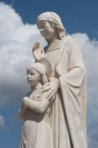 Low angle view of statue against sky