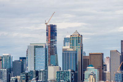 Modern buildings against sky in city