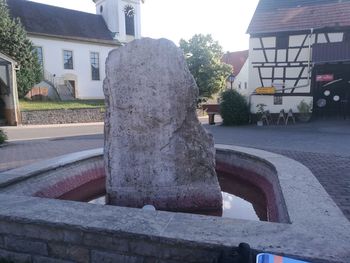 Sculpture outside house against sky