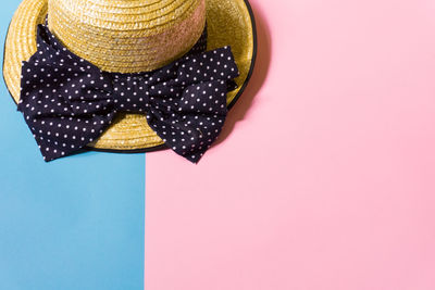 Close-up of hat over colored background