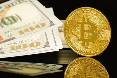 Close-up of coins on black background